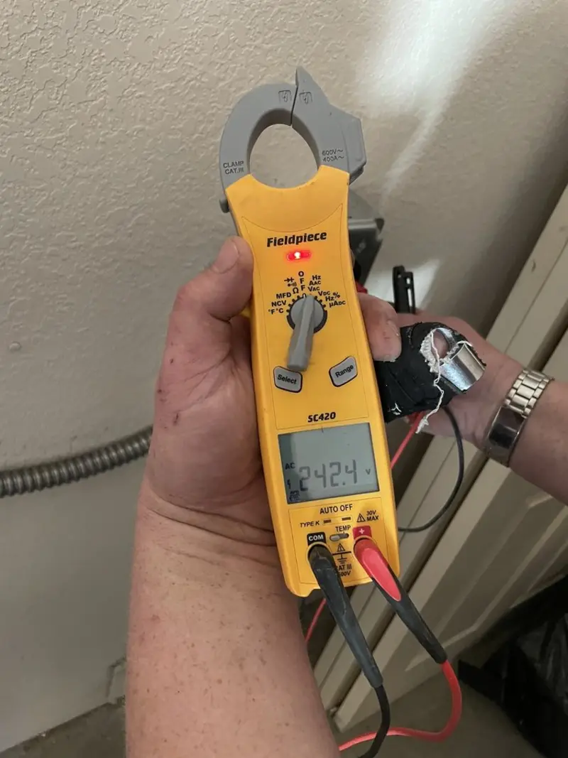 Voltage testing with clamp meter during Outlet Installation in River Park